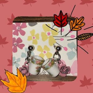 Adorable tea cup earrings with a pink dainty rose